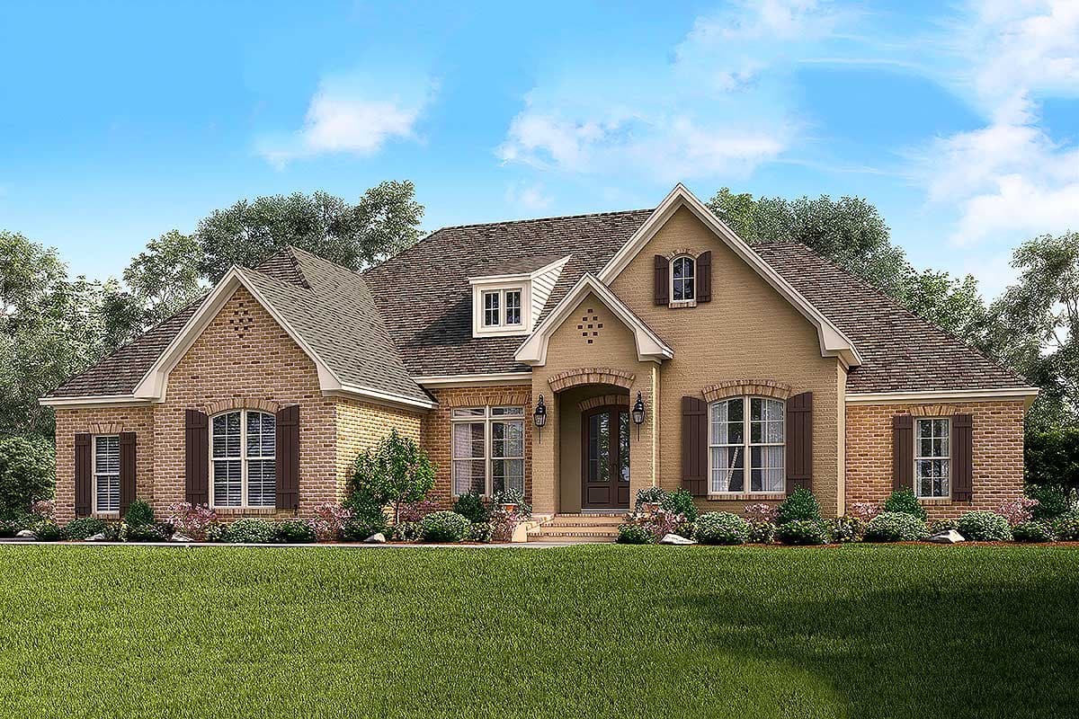 House plan exterior: One-story home with arched entry, brick accents, dormers, and prominent gables.