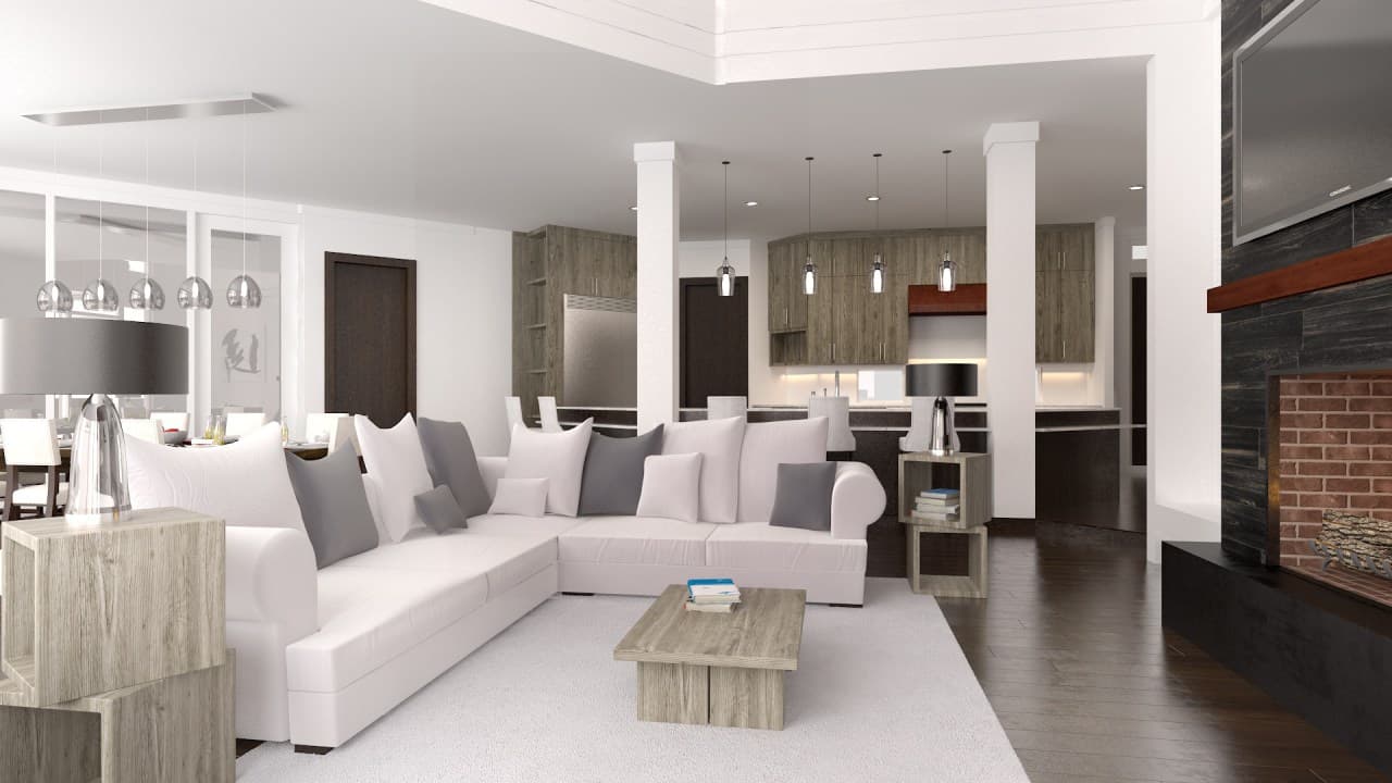 Open-plan living area with sectional sofa, kitchen with wood cabinetry, and brick fireplace.