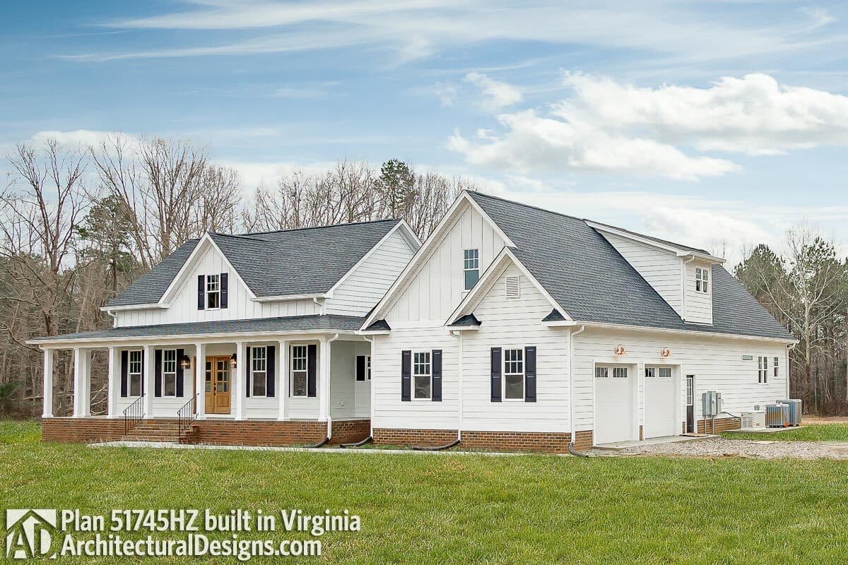 House plan exterior: Modern Farmhouse style with wrap-around porch, gables, dormer, and attached two-car garage.