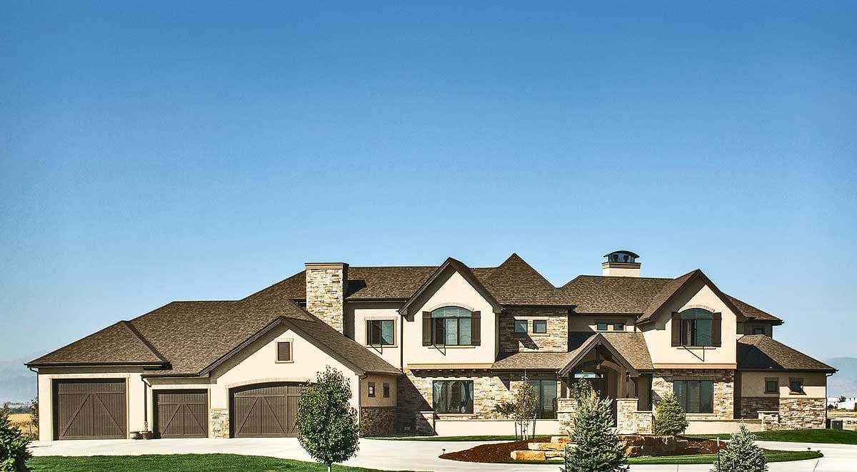 House plan exterior with stone accents, multiple gables, and a three-car garage. Two-story home with a hipped roof and dormers.