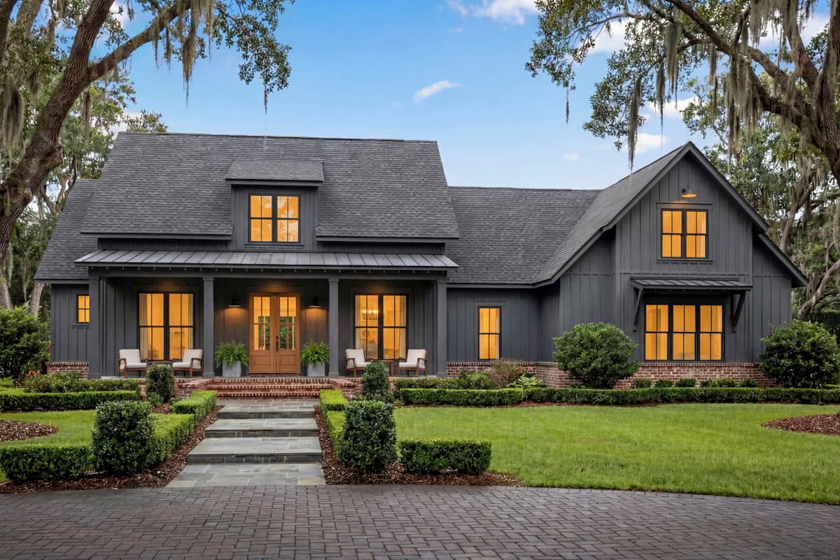 Modern Farmhouse house plan exterior with a covered front porch, metal roof, board and batten siding, and dormer.