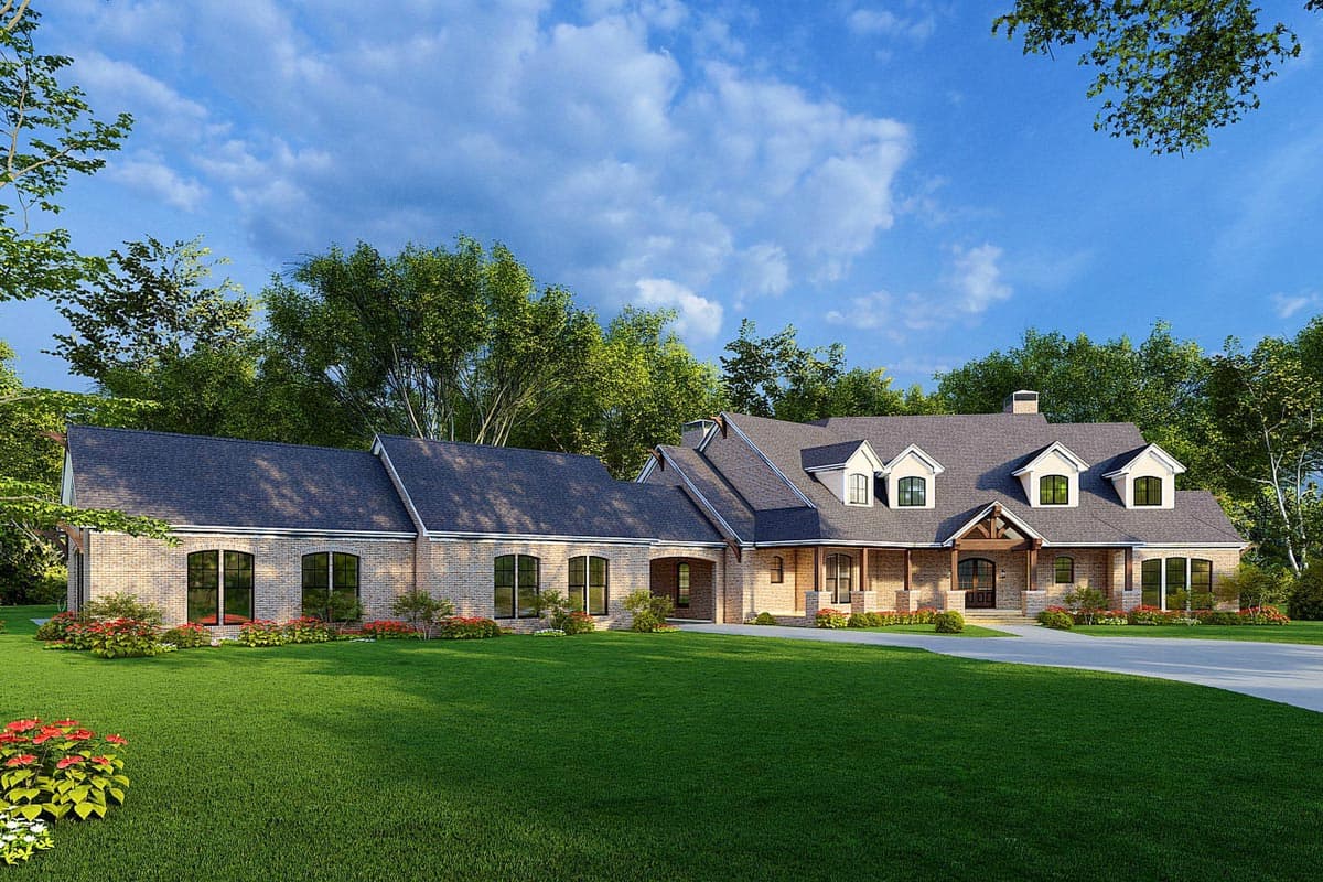 House plan exterior. Two-story home with a brick facade. Features include a front porch, dormers, and a gabled roofline. Attached garage.