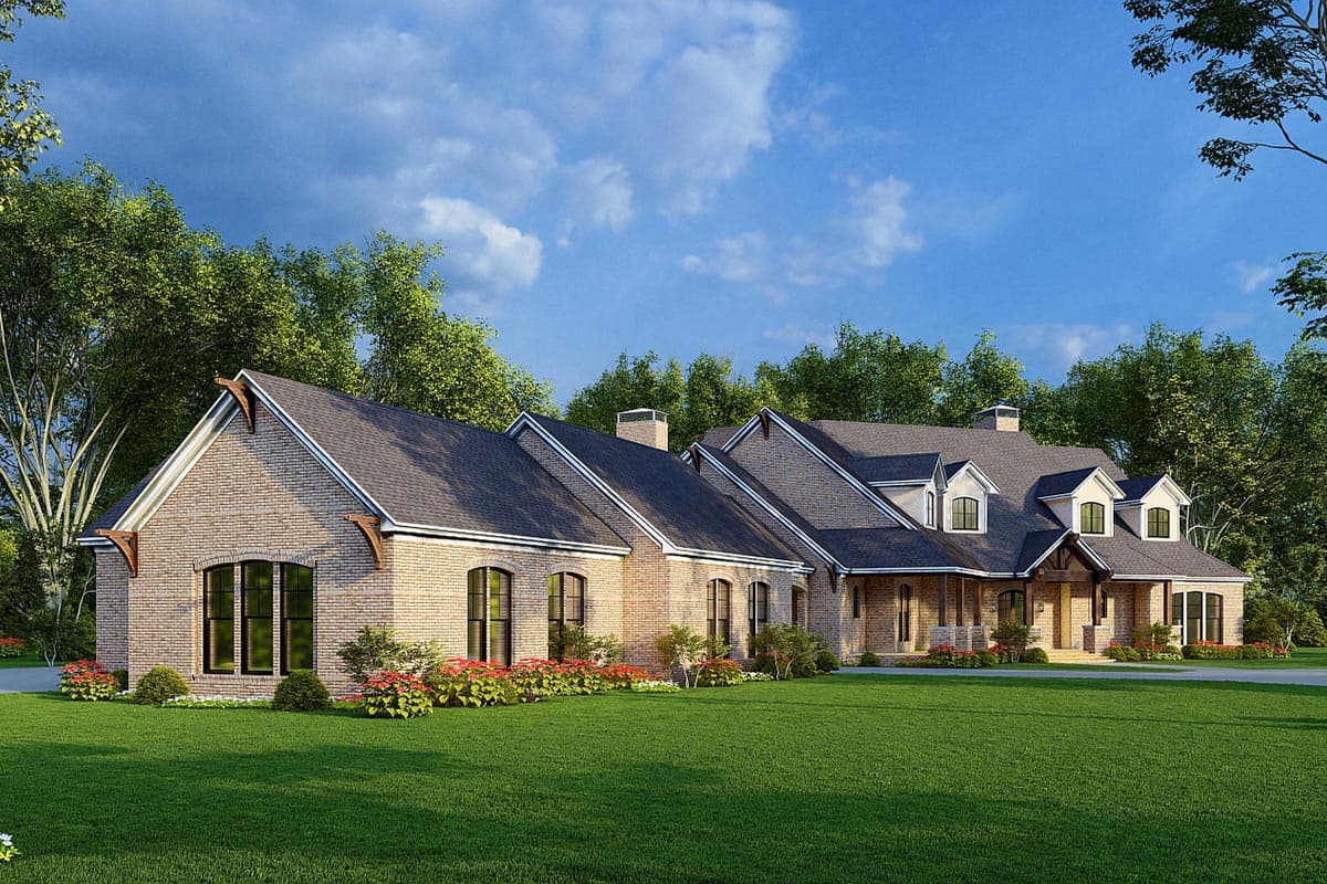 House plan exterior: Brick two-story home with multiple gables, dormers, and arched windows.