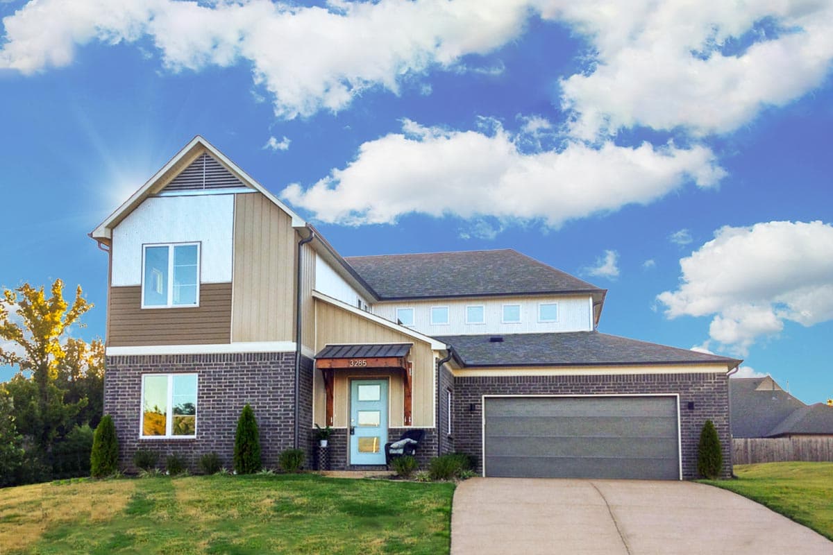 Two-story house plan exterior with gable roof, brick and siding exterior, front porch, and attached garage. Includes accent siding and a blue door.