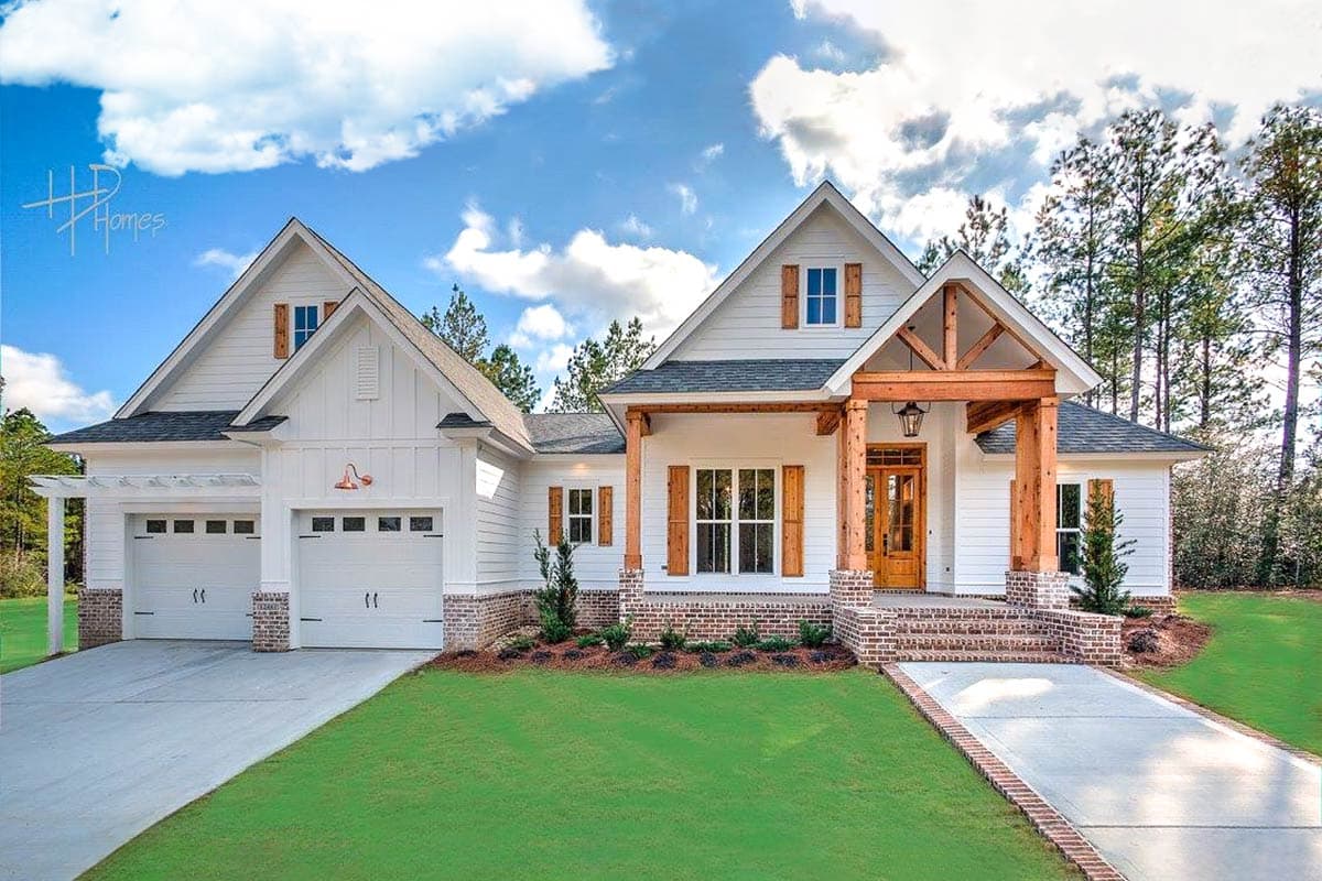 House plan exterior: White two-story Modern Farmhouse with a three-car garage, board and batten siding, brick accents, and exposed wooden beams.