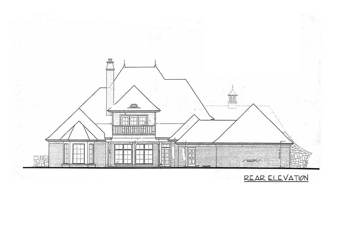 Rear elevation drawing of a house plan featuring a prominent chimney, multi-level rooflines, and a balcony above French doors.
