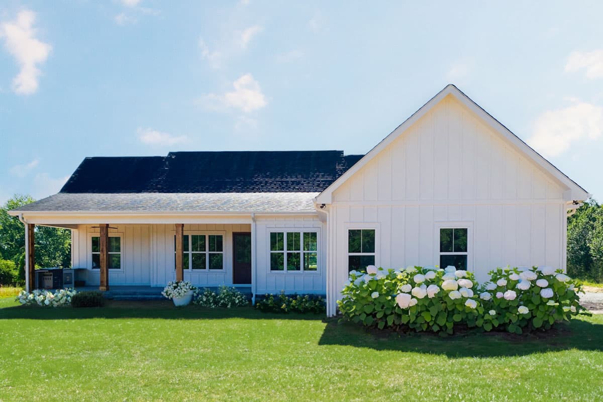 Modern Farmhouse house plan exterior with a covered front porch, board and batten siding, and large gables.