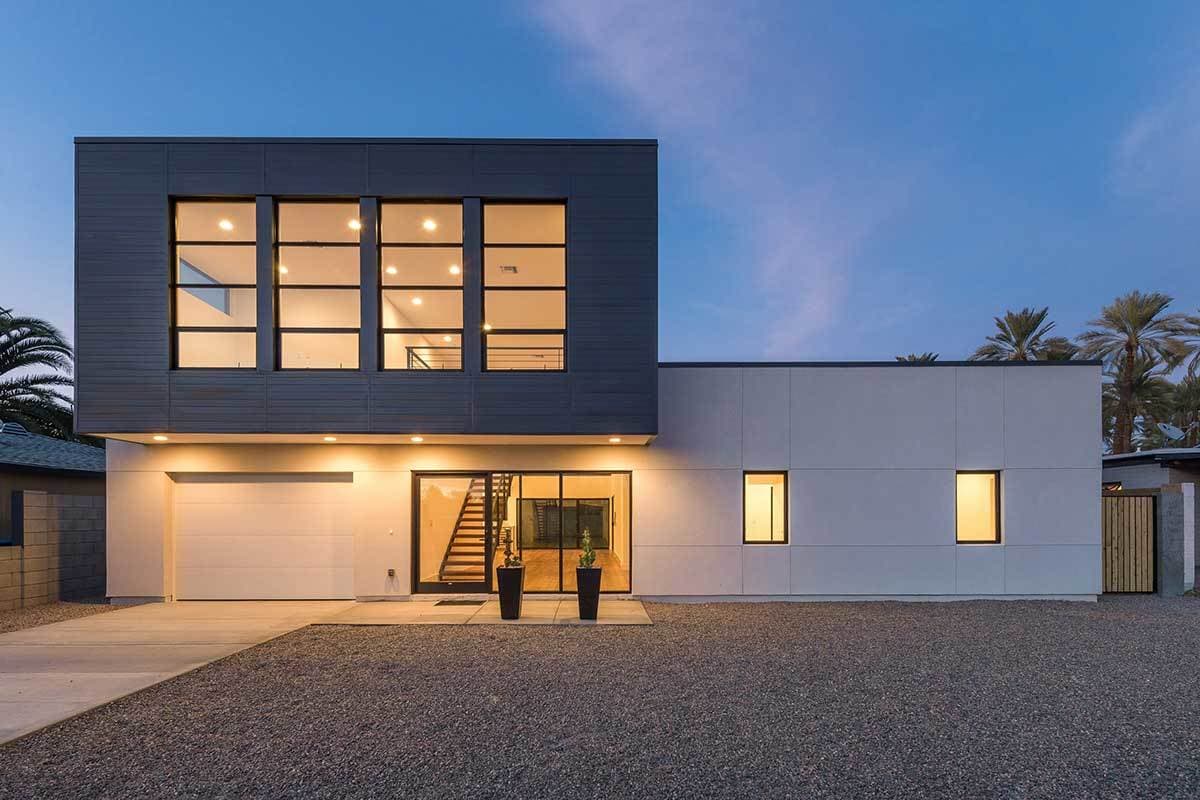 Modern house plan exterior with two stories, large horizontal windows, a flat roof, and a prominent garage.