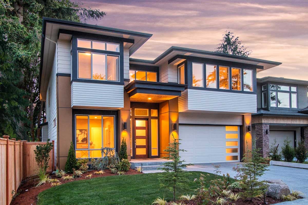 Modern house plan exterior with two stories. Features include a flat roof, large windows, and an attached garage. Horizontal siding is present.