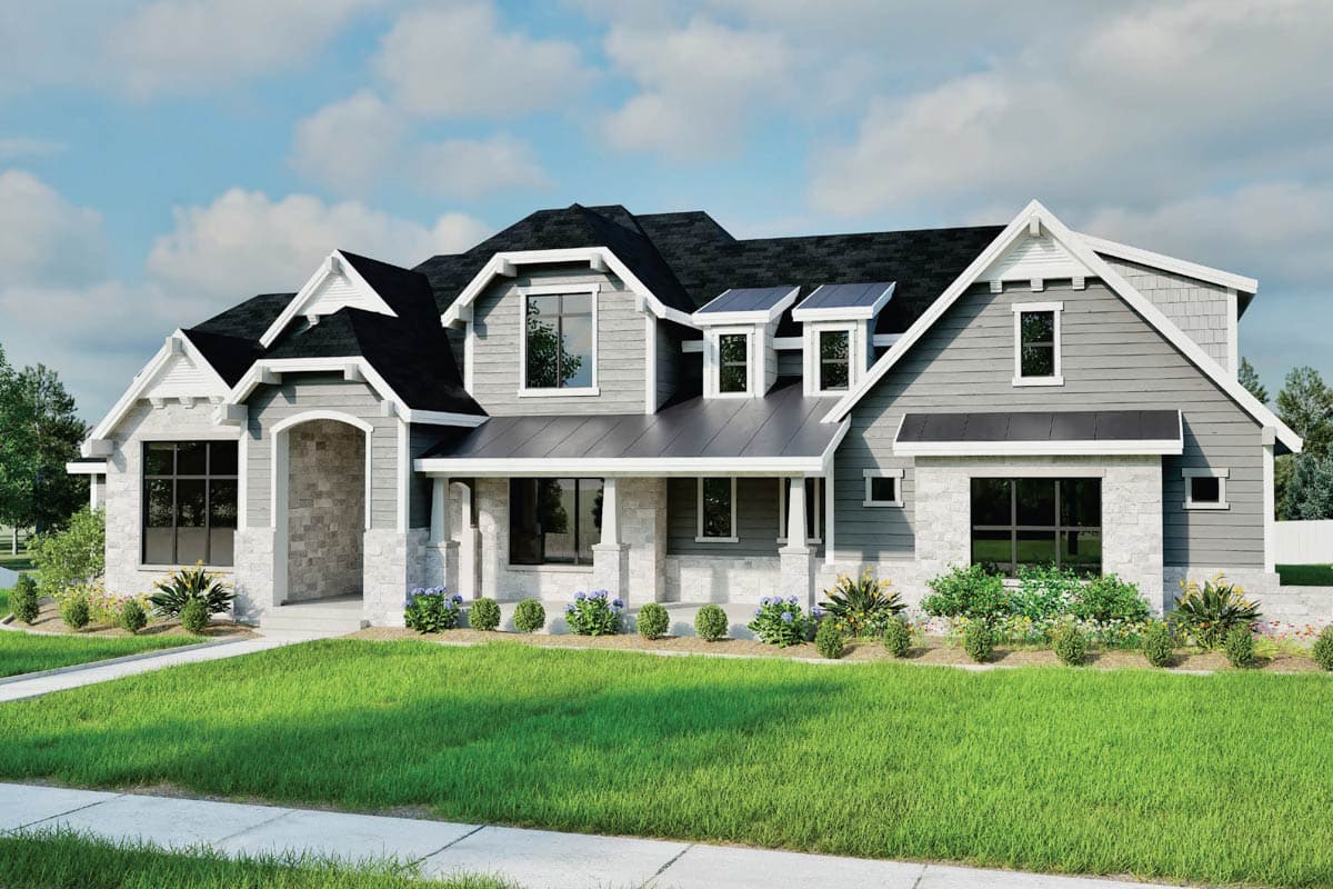 House plan exterior. Craftsman style, two-story house with gables, a covered porch, and dormers. Features stone and gray siding.