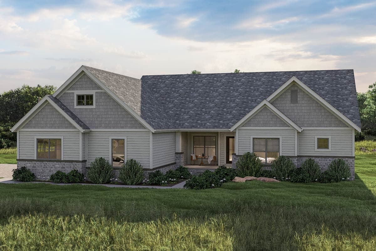 House plan exterior featuring a single-story design. Highlights include gables with shake siding, a covered porch, and a stone veneer foundation.