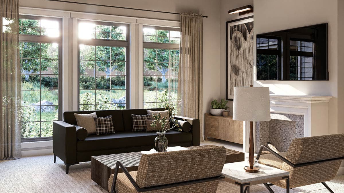 Living room with large windows, fireplace, dark sofa, and two armchairs. Modern interior design.