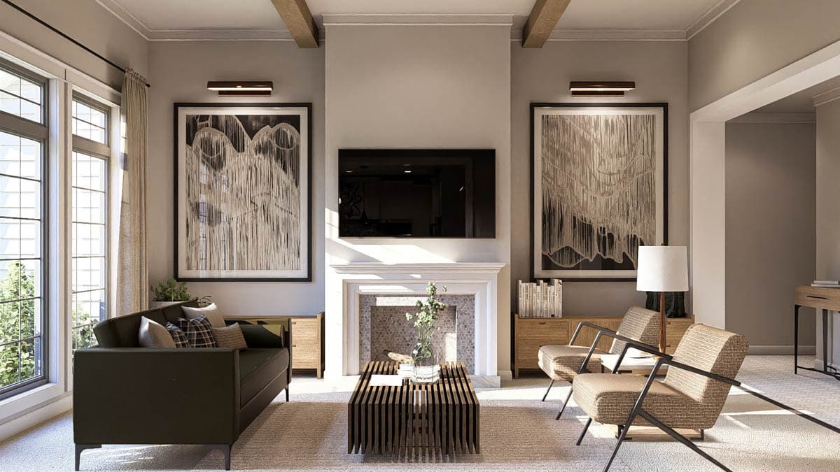 Living room with fireplace, mounted TV, large windows, two armchairs, and a sofa. Exposed wood beams overhead.