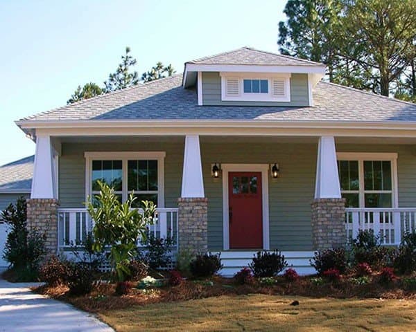 Craftsman-style house plan exterior with a single story, front porch with stone and white columns, and a dormer.