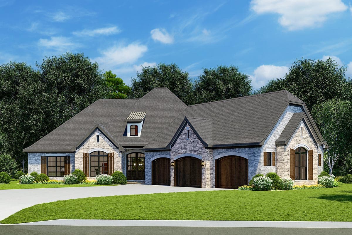 House plan exterior with stone veneer, arched garage doors, multiple gables, and a dormer. One-story house plan.
