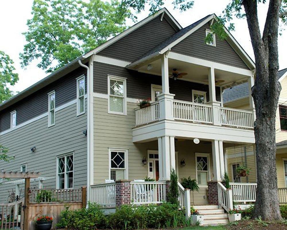 House plan exterior with two stories. Craftsman style with a covered porch, gabled roof, and decorative railings.