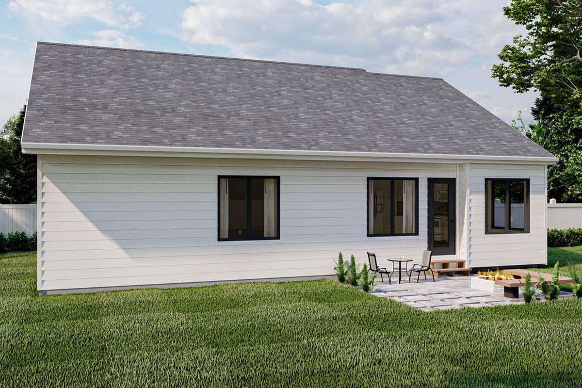 Modern house plan exterior: one-story white siding, asphalt shingle roof, three windows, and a rear door leading to a patio with a fire pit.