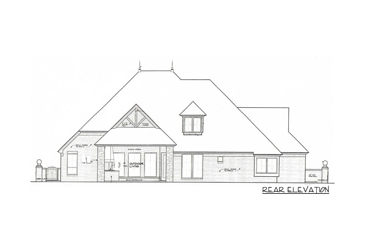 Rear elevation drawing of a house plan featuring brick veneer, stucco, a prominent roofline with dormers, and an outdoor living area.