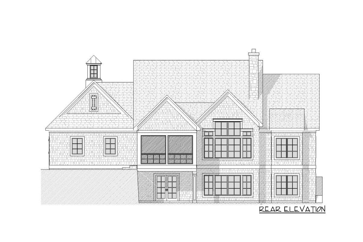 Rear elevation drawing of a two-story house plan with gables, dormers, a cupola, and multiple windows.