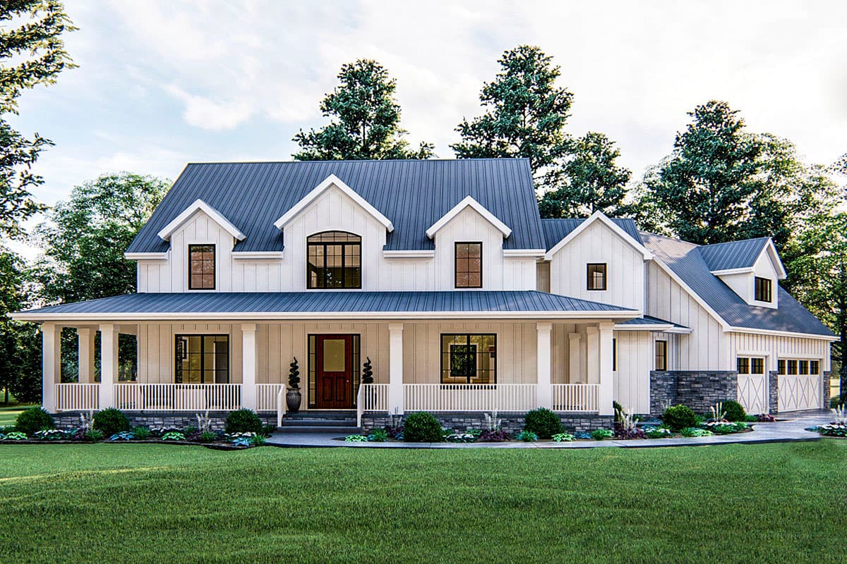 Farmhouse style house plan exterior with two stories, a front porch, gables, and a detached garage.