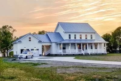 Modern Farmhouse Plan with Wrap-Around Porch and Breezeway
