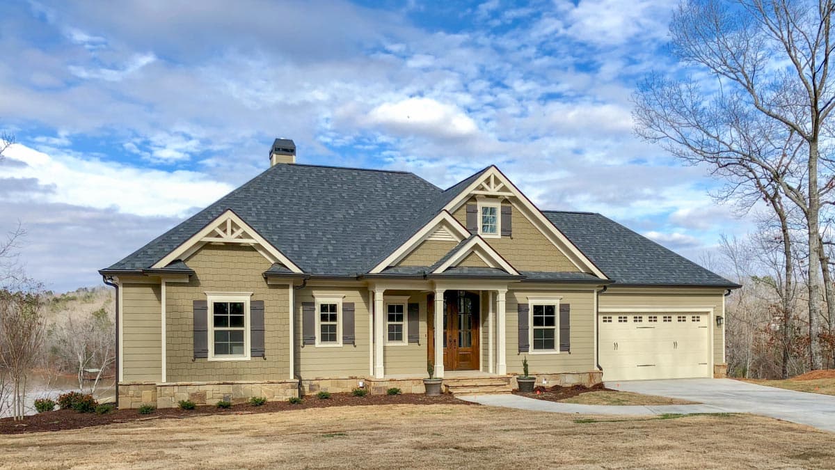 Craftsman house plan exterior, one story, with a covered front porch, gables, and a side-entry garage.