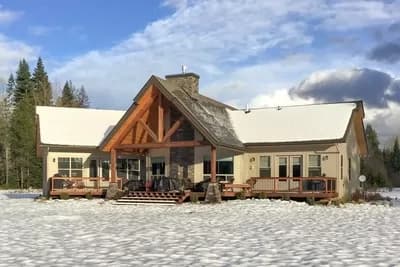 Rustic Mountain Lodge with Vaulted Interior and Angled 2-Car Garage