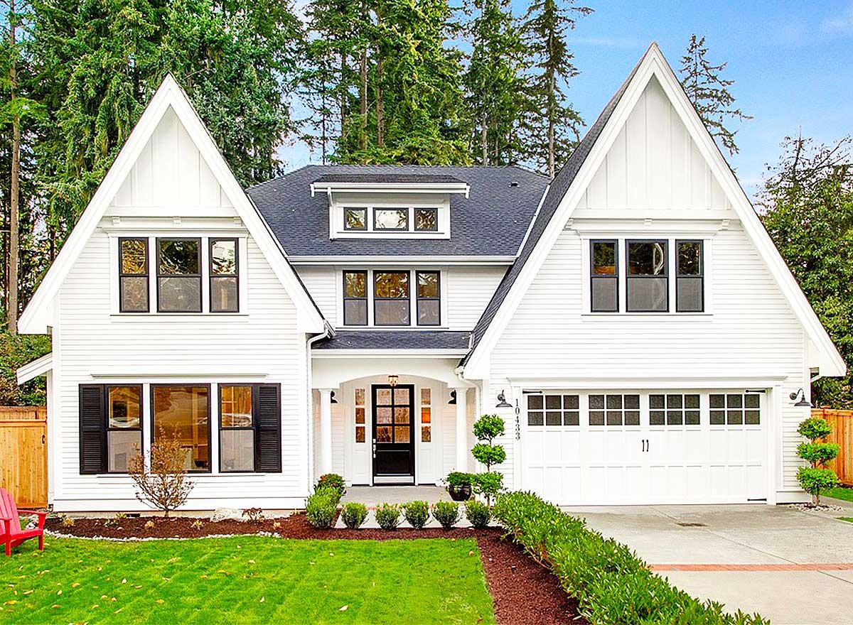 Two-story house plan exterior with a gable roof, Craftsman style, and a garage door with multiple panels.