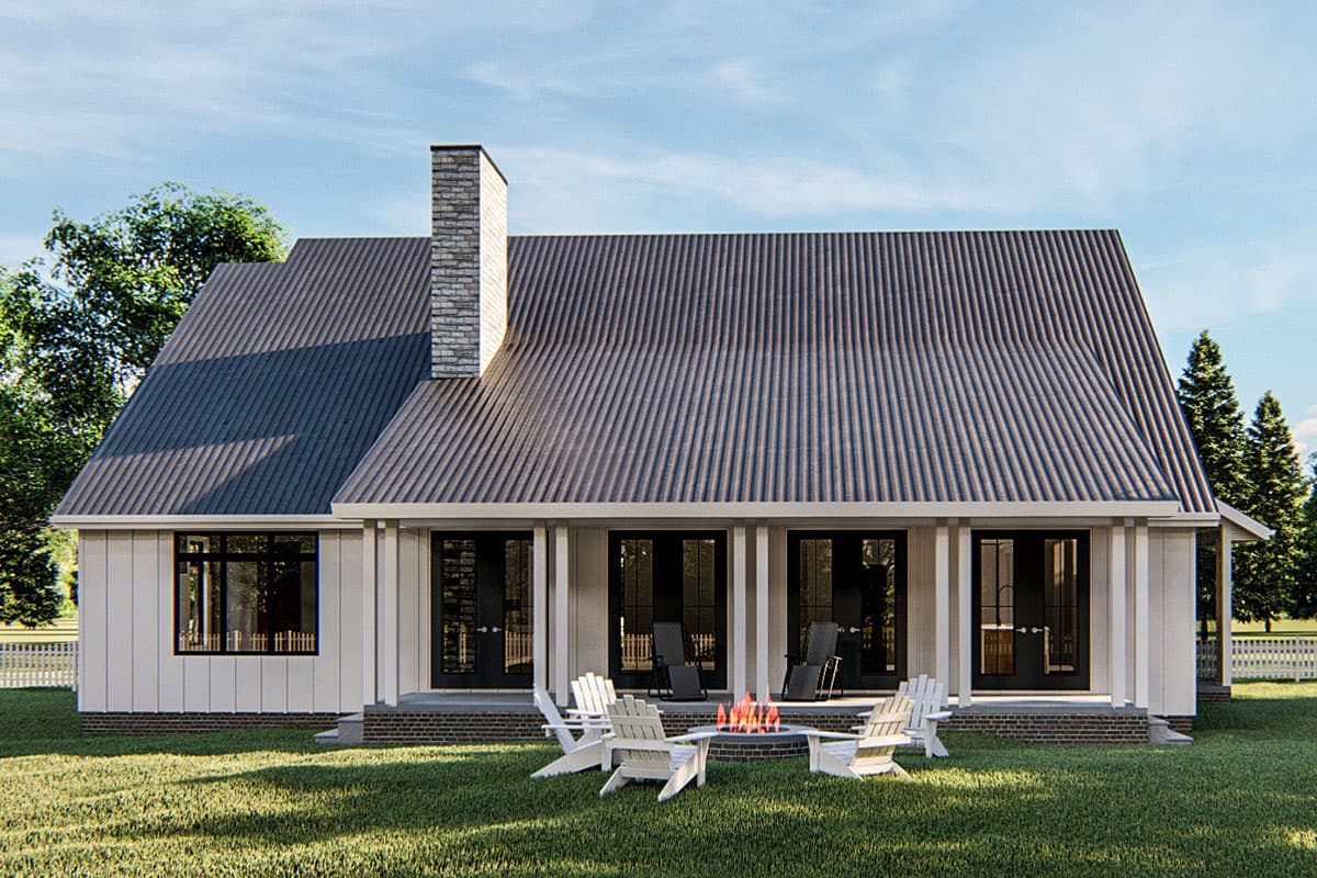 House plan exterior: Modern style, one-story with metal roof, prominent brick chimney, and a covered porch with french doors.