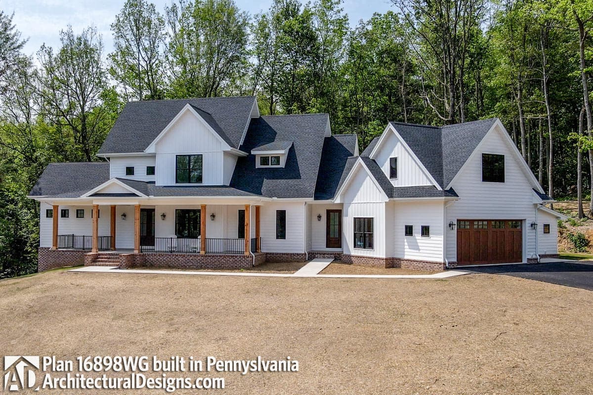 Modern Farmhouse house plan exterior with wrap-around porch, gables, dormers, and attached garage.