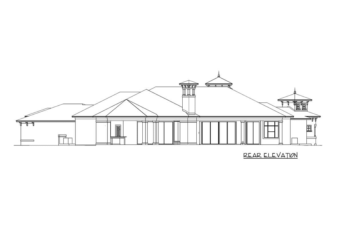 Rear elevation drawing of a house plan featuring a large roofline, fireplace chimney, multiple window sections, and a small turret.