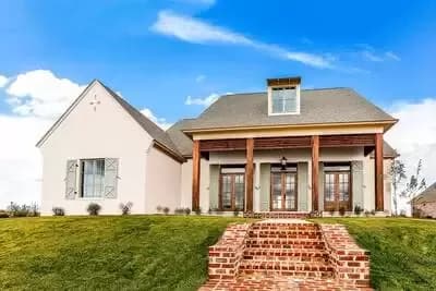 Welcoming Acadian House Plan with Bonus Over Garage