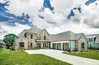 Stone and Stucco Beauty with Courtyard Entry Garage