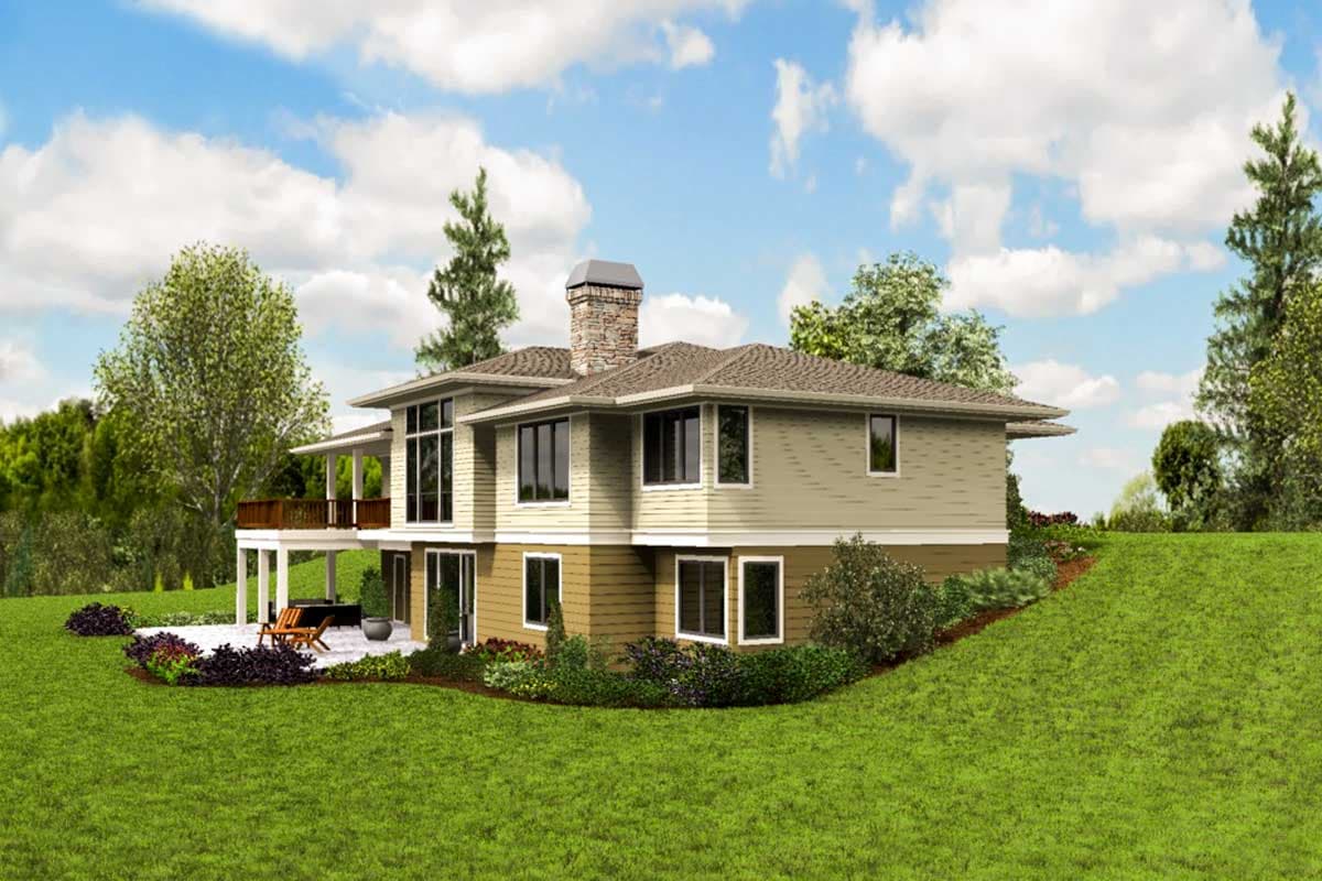 House plan exterior, two stories, featuring a stone chimney, wraparound deck, and multiple large windows.