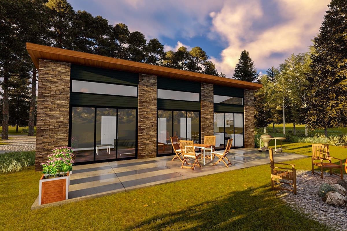 Modern house plan exterior with stone facade, flat roof, and expansive horizontal windows. Features patio seating.