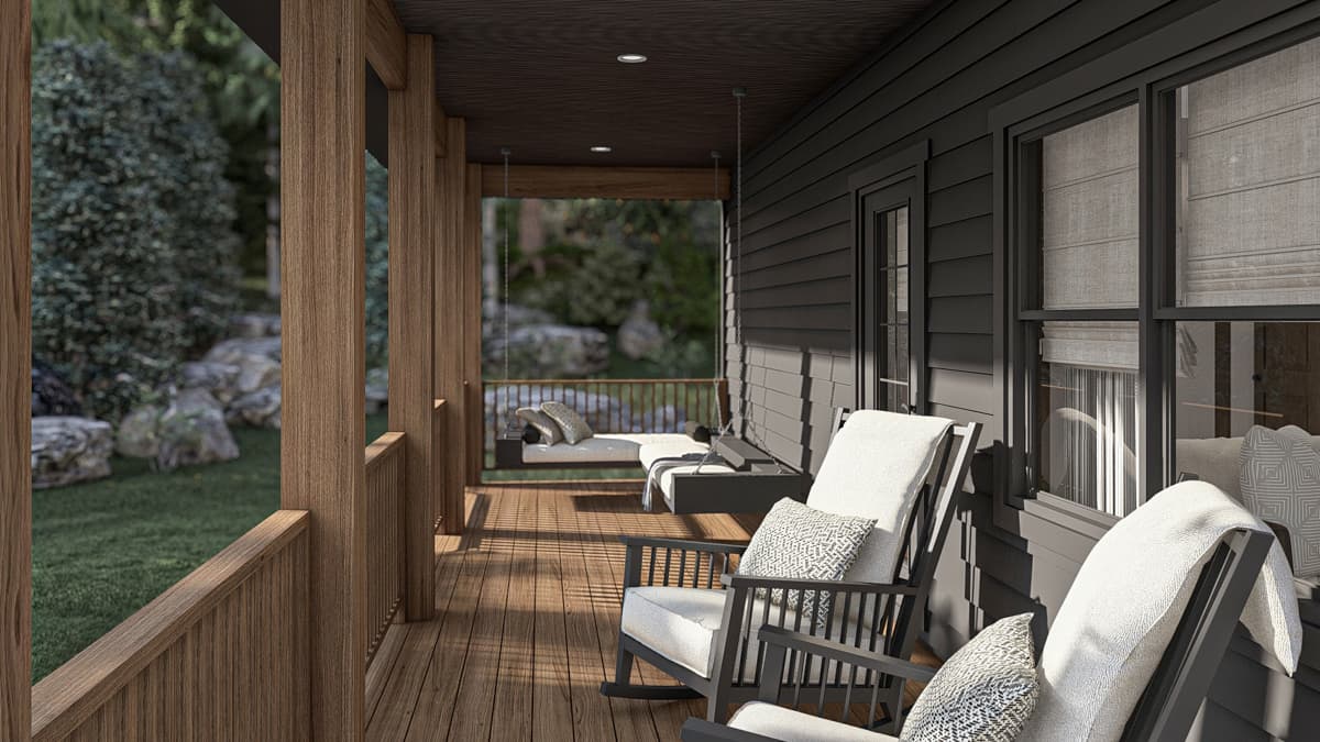 House plan exterior with wraparound porch, wooden posts, rocking chairs, and a swing.