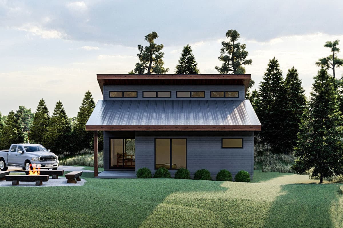 House plan exterior: Modern two-story home with metal roof, clerestory windows, covered entry, and wood accents.