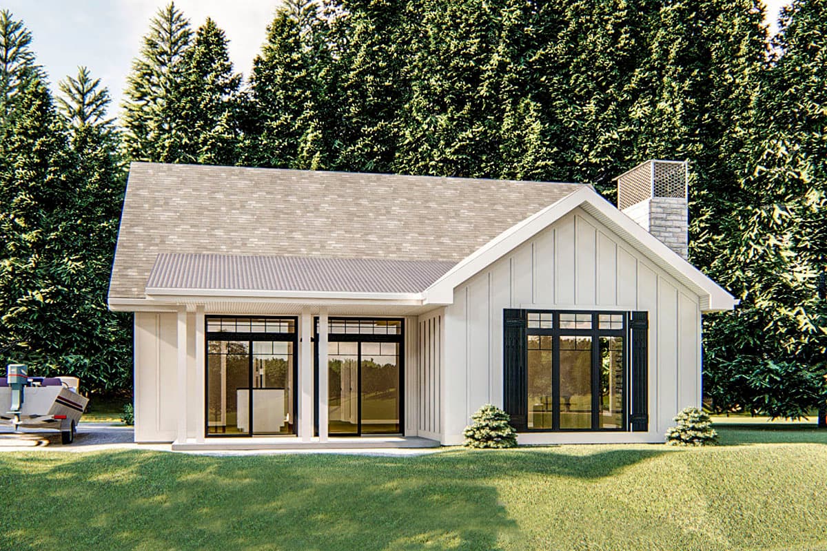 House plan exterior. One-story farmhouse with a gabled roof, a covered porch, and a chimney. Vertical siding and black window frames.