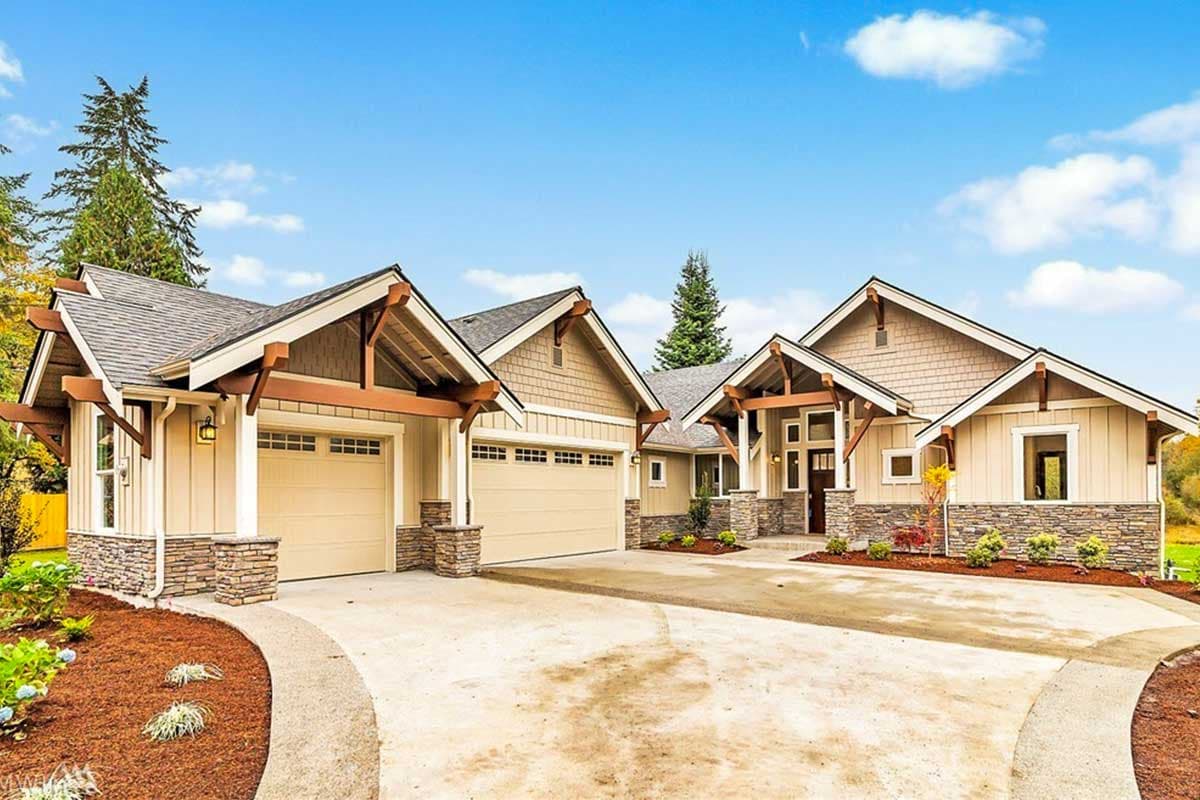 House plan exterior featuring a Craftsman style. Shows a single-story home with multiple gables, exposed rafters, and attached garages.