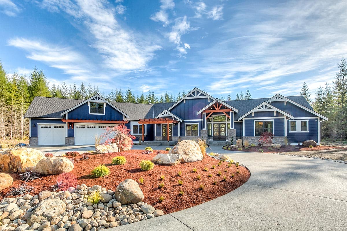 House plan exterior: Modern Farmhouse style, blue siding, multiple gables, wood beams, attached 3-car garage, covered entry.