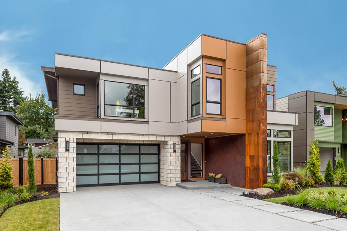 House plan exterior. Modern style with flat roof and large windows. Features include a two-car garage and a unique facade with contrasting materials.
