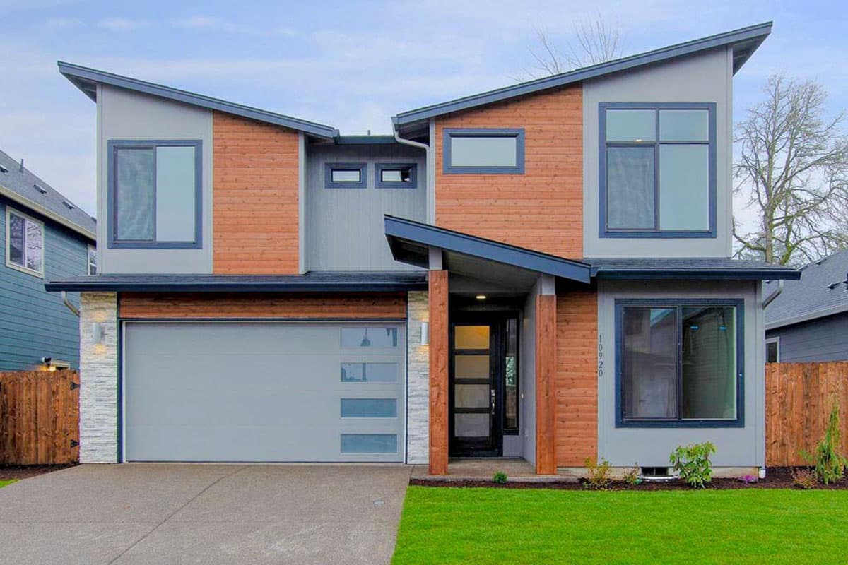 Modern house plan exterior with two stories, a contemporary roofline, wood siding accents, and a front-entry portico.