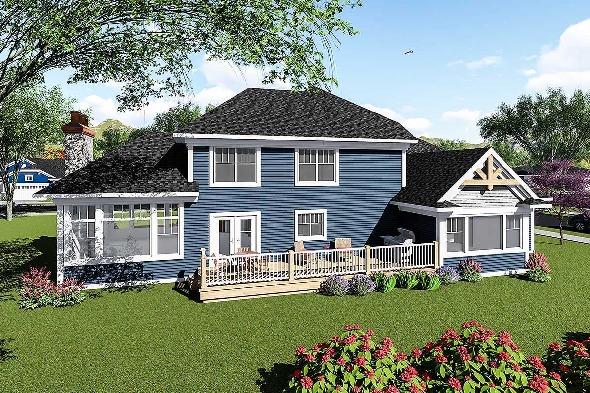 House plan exterior: two-story blue home with white trim, prominent gables, deck, and stone chimney.