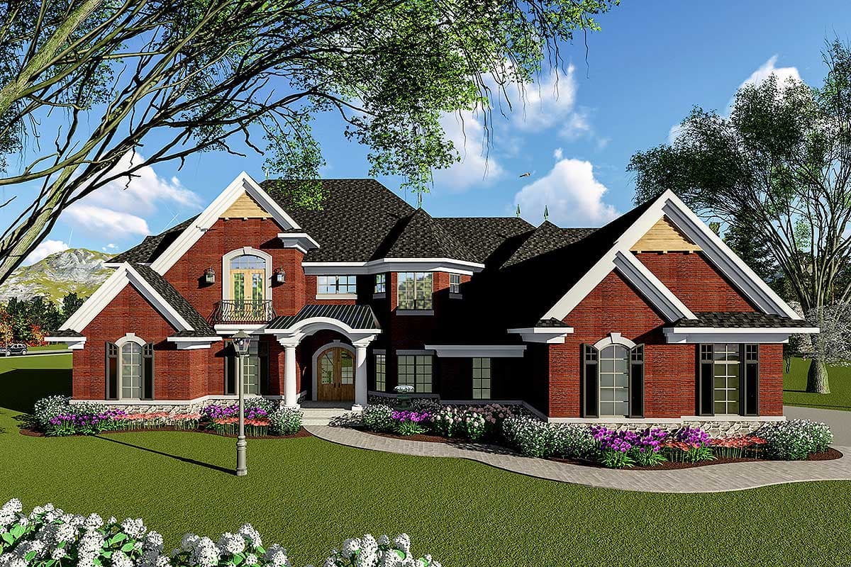 House plan exterior. Two-story brick home with gables, arched windows, and a covered front entry. Features include a balcony and varied rooflines.
