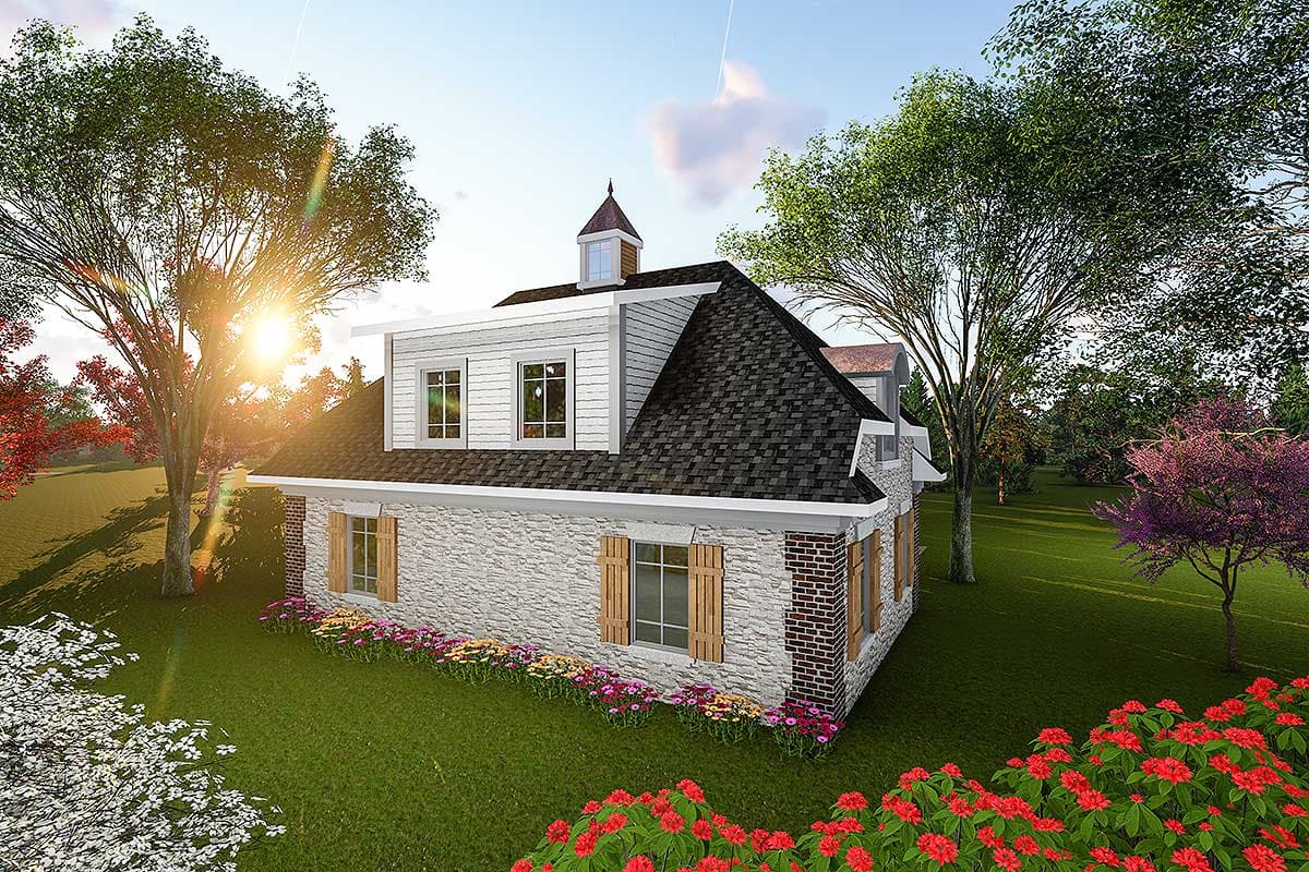 House plan exterior: Two-story dwelling with stone and brick facade, steeply pitched roof, dormer windows, and cupola.