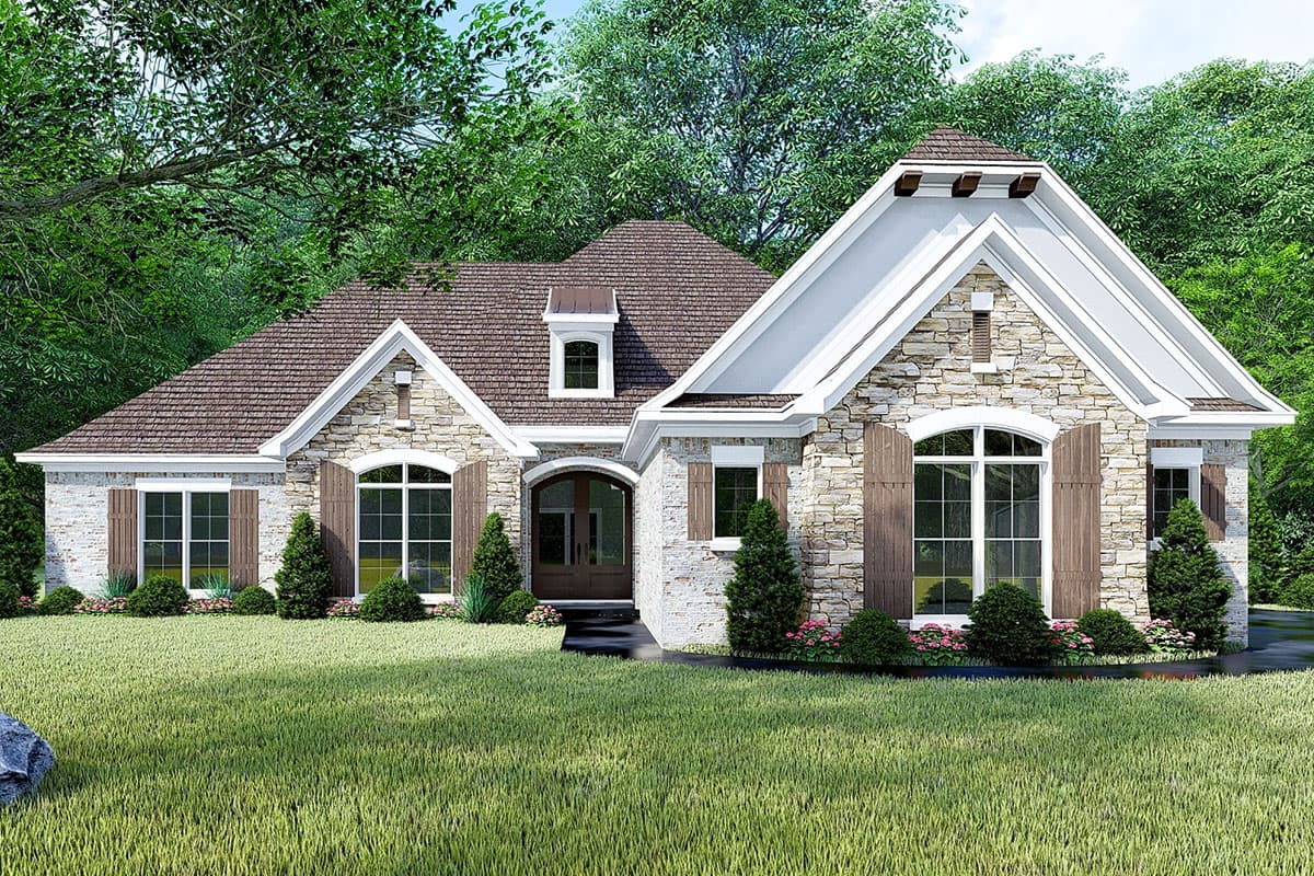 House plan exterior. Stone-clad, one-story home with gabled roof, dormers, and arched window. Shutters flank windows.