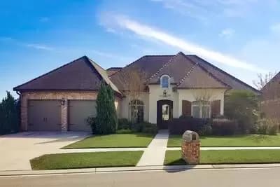 3-Bed French Country-Style House Plan with Brick and Stucco Exterior