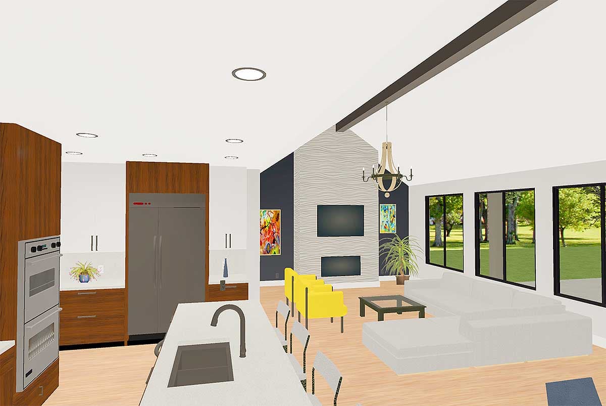 Open concept living space with island kitchen, fireplace, and large windows.