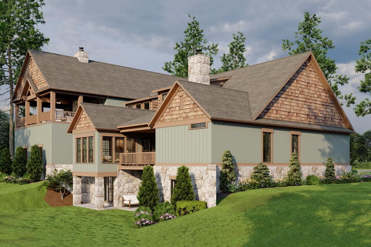 House plan exterior featuring layered gables, cedar shake accents, stone foundation, and covered decks.
