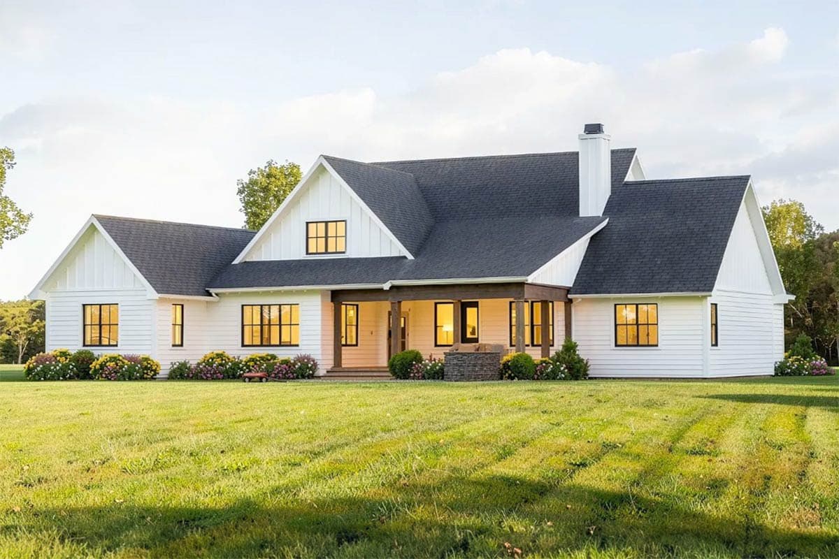 Modern Farmhouse house plan exterior with board and batten siding, gables, wide porch, and prominent chimney.